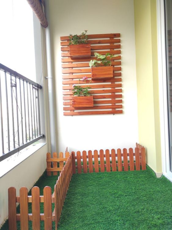 Aminimal wall designed balcony with pots and furniture is classy decor theme